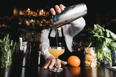 bartender pouring a drink