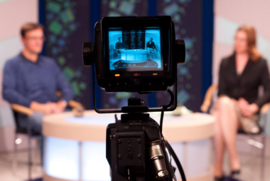 camera recording two people